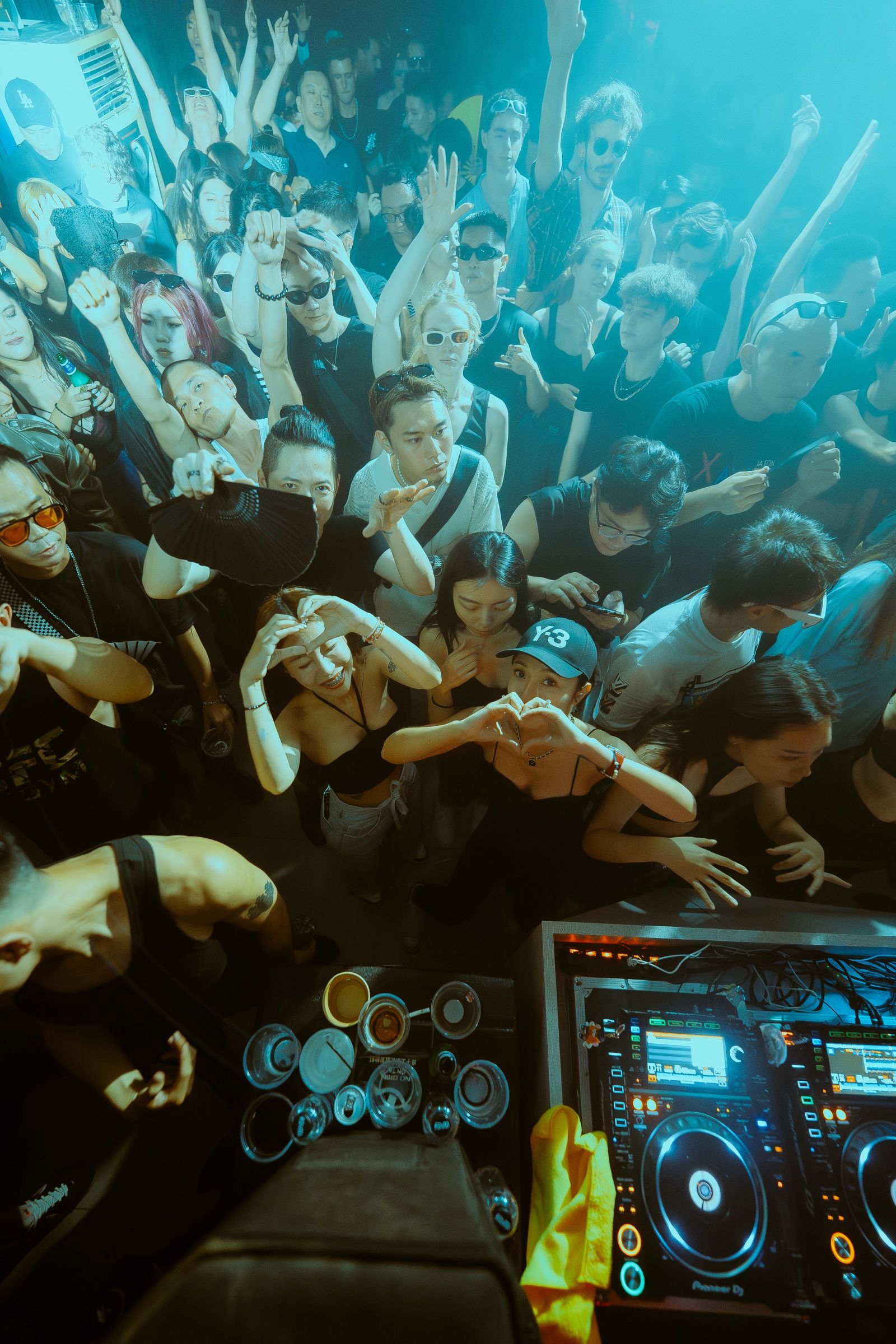 Hands raised across the floor